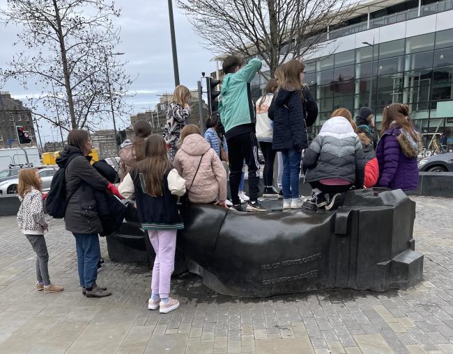 Children playing on part of Paolozi's 'Manuscript of Monte  Cassino'.