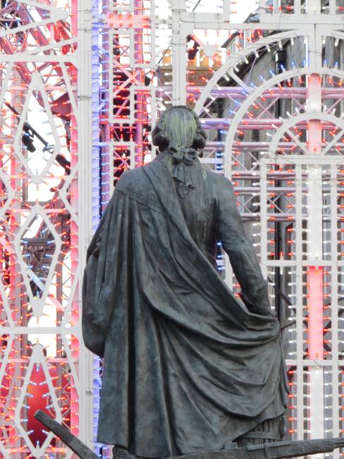 Adam Smith in foreground. Virgin Money Christmas lights in background.