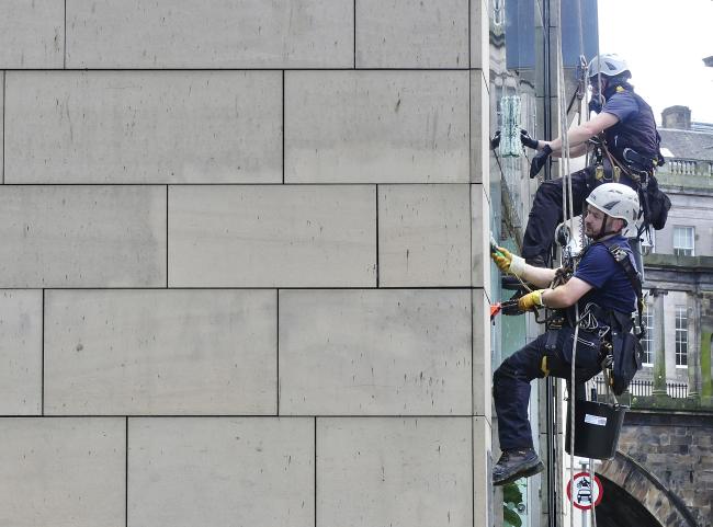 Zelensky lookalike window cleaner.